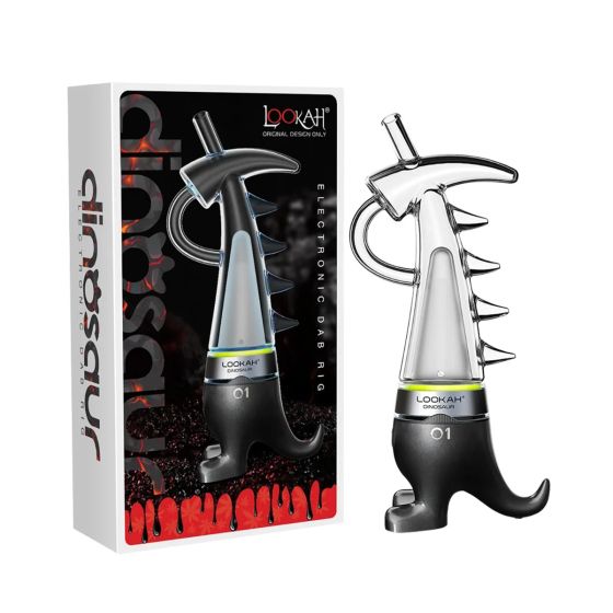 Dab rig électronique Lookah Dinosaur présenté à côté de son emballage, avec un design original inspiré d'un dinosaure, une base violette en forme de pattes, un corps en verre transparent avec des pics et un embout buccal incurvé.