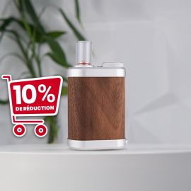 Tinymight 2 vaporizer with a sleek wooden body, metal accents, and a glass mouthpiece, set against a soft background.